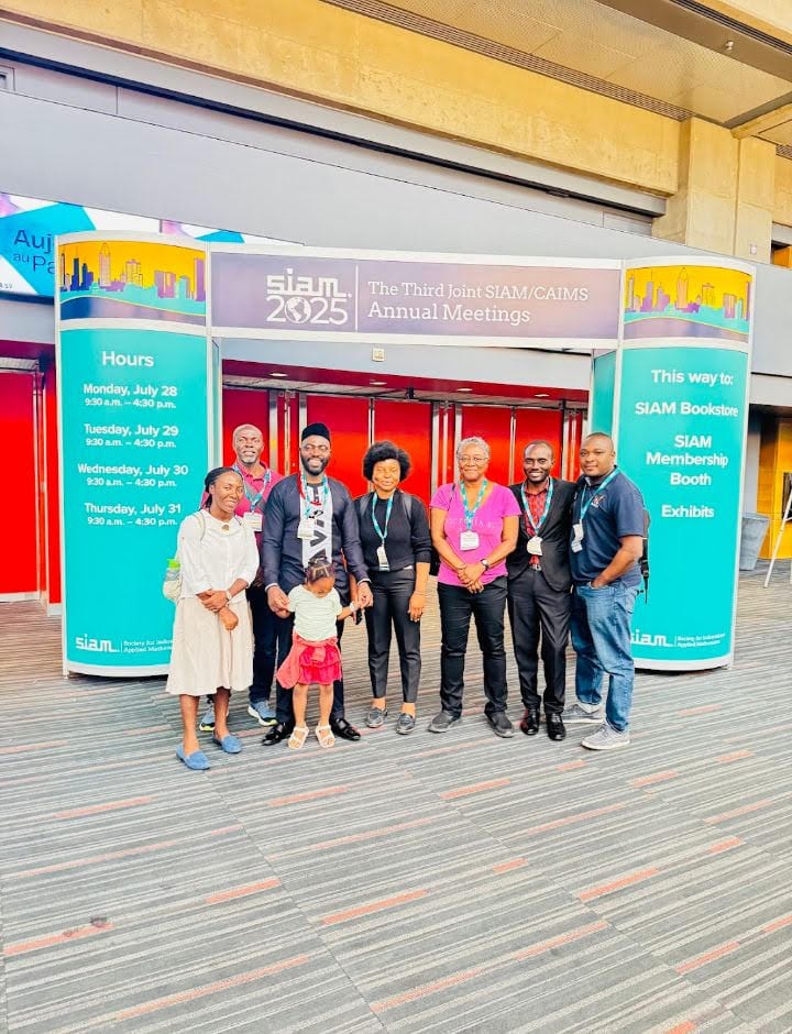 Dr. Andrew Omame with conference attendees