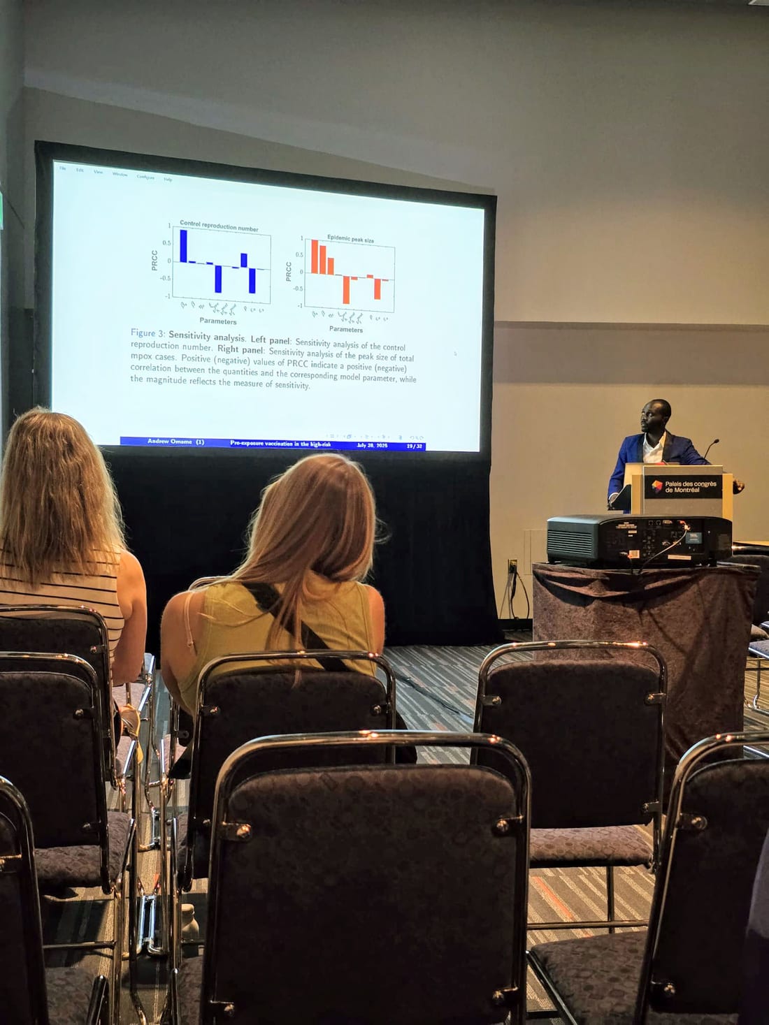 Dr. Andrew Omame presenting his research