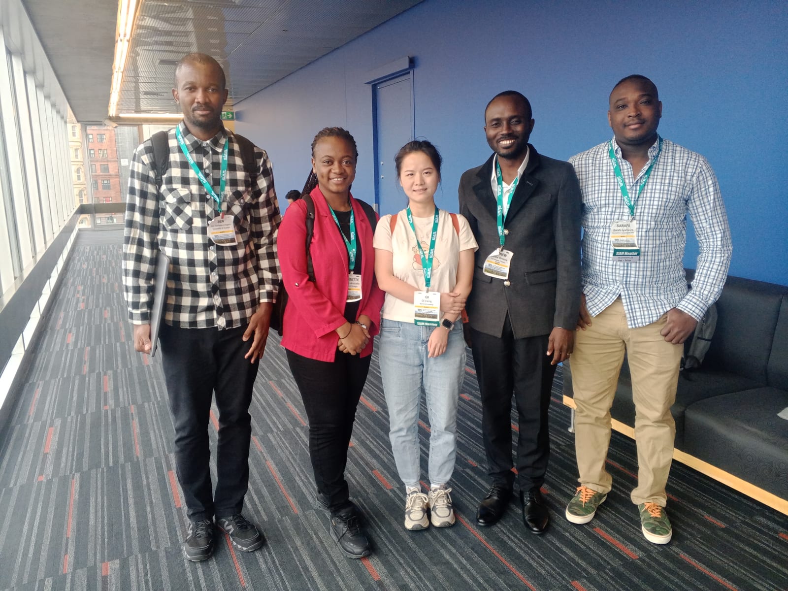 Dr. Andrew Omame and Dr. Qi Deng at the conference